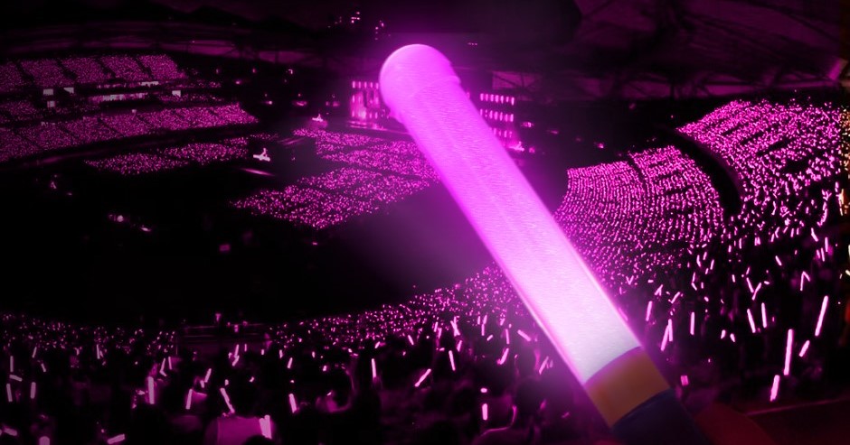Bulk custom cheer sticks audience crowd at concert event - synchronized colorful display