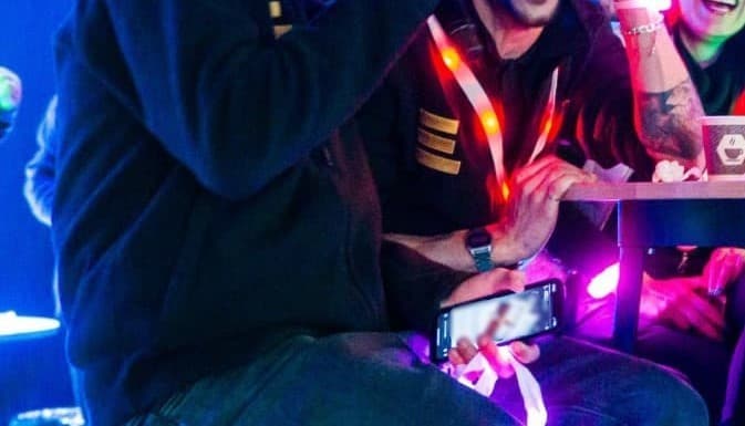 Custom light up LED lanyard with company logo printed on strap and glowing badge