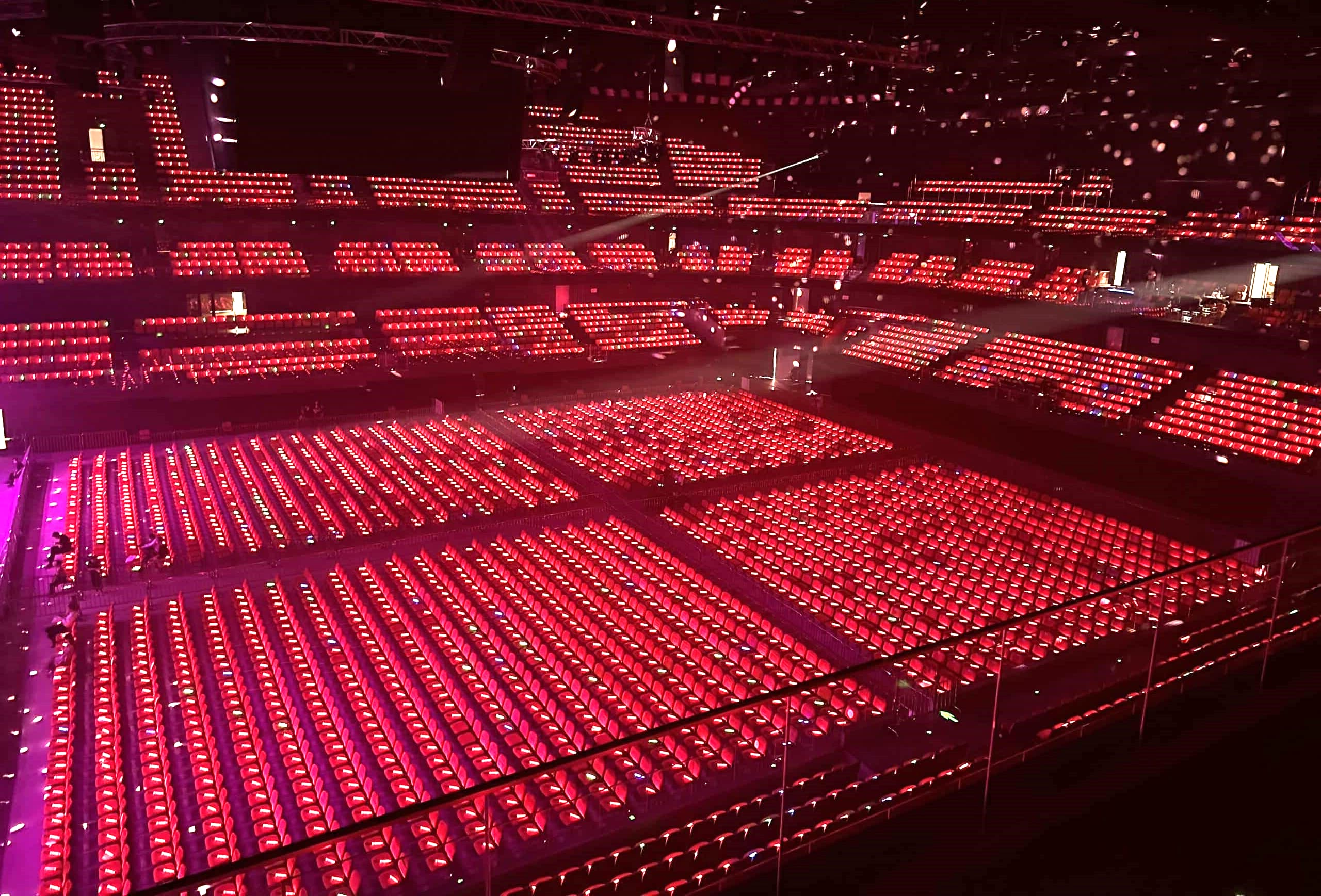 Custom LED lightstick music festival deployment with colour-coordinated audience sections using DMX wireless zone control