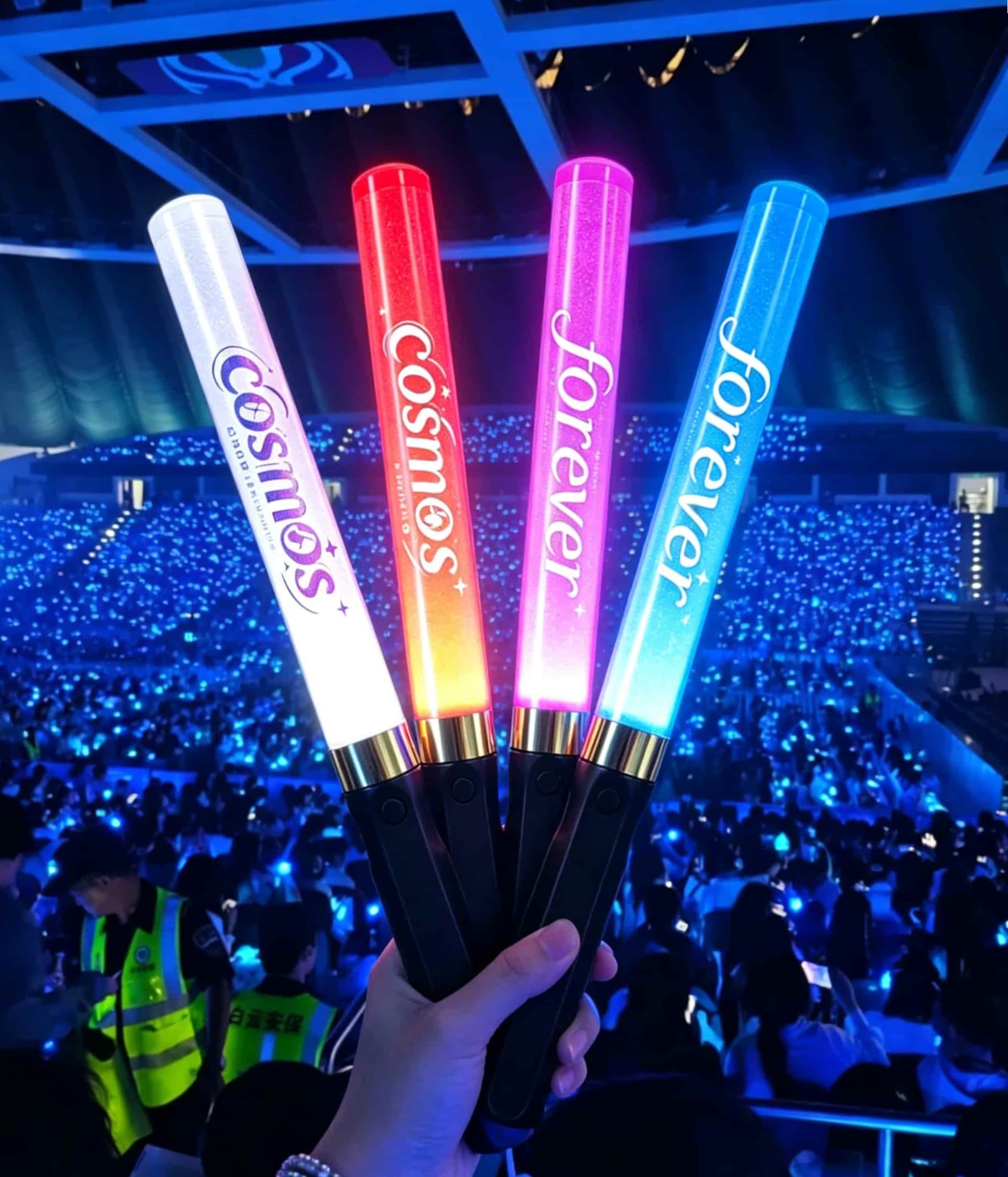 Reusable LED sticks glowing at a K‑pop concert