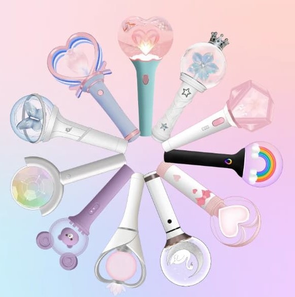 Group of fans holding customizable reusable LED concert sticks