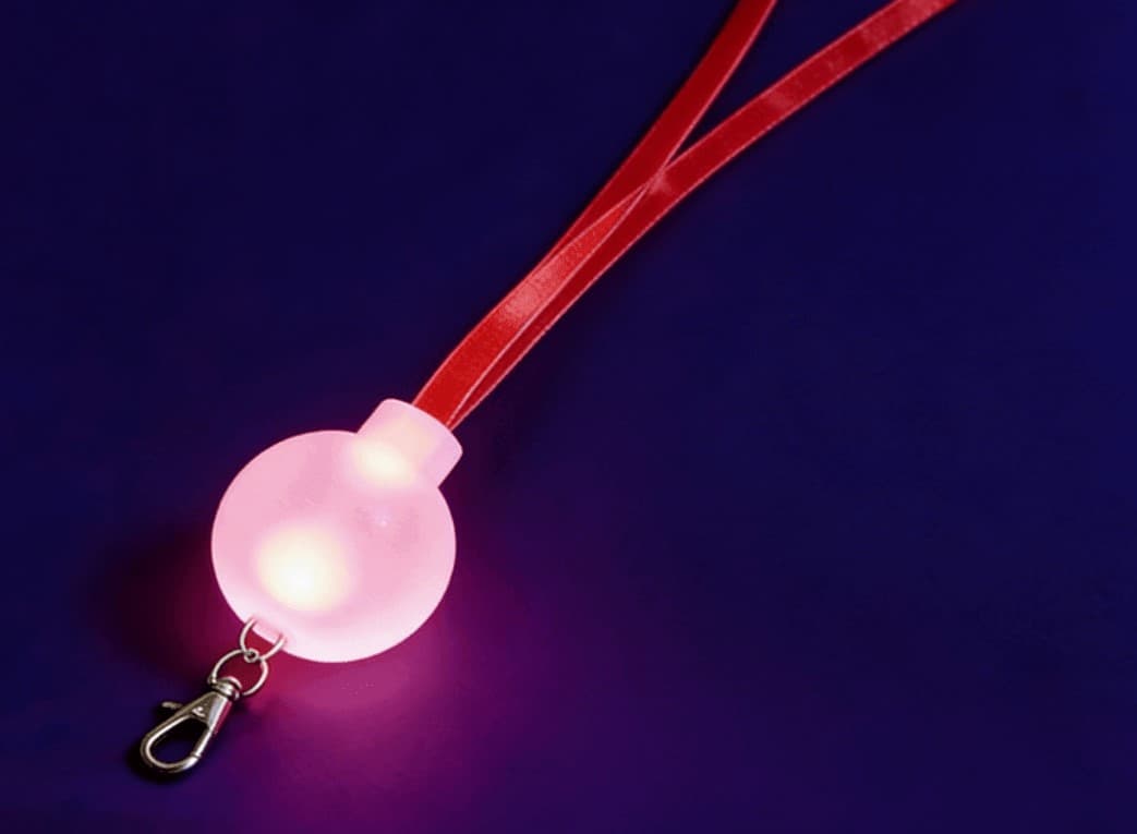 GFLAI GFH-002 TPU transparent LED lanyard glowing with logo illumination on dark background