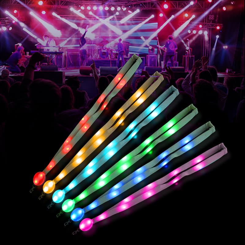 LED lanyard glow showing strap-lit badge-lit and full-body lighting zones on event attendees