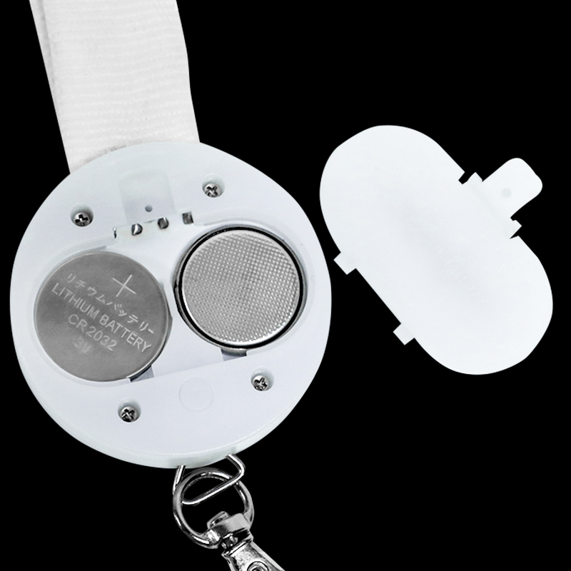 LED light up lanyard battery replacement showing CR2032 coin cell and open battery compartment
