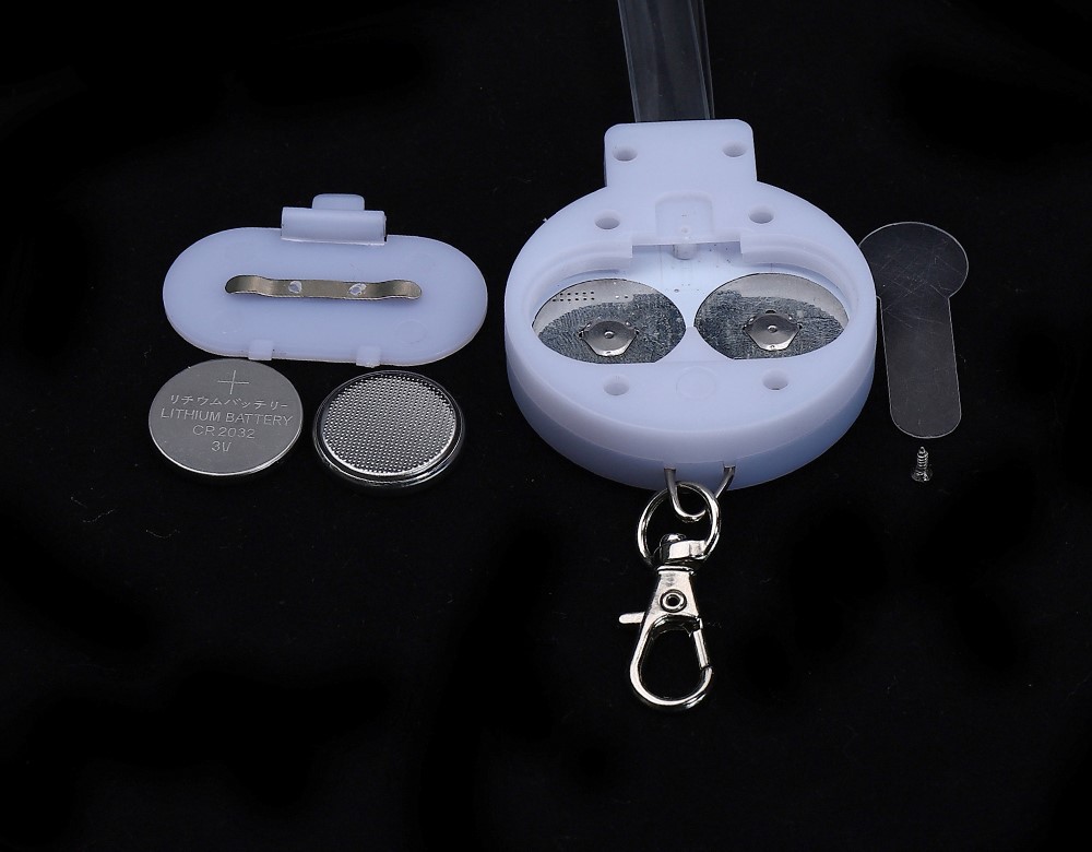 LED light up lanyard unboxing showing lanyard batteries manual and accessories in packaging