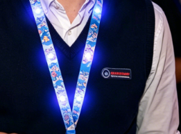 Lanyard with LED lights embedded directly in the strap creating a full line of light along the neck strap